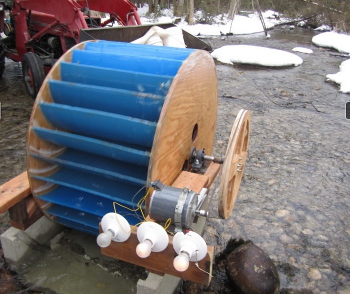 A do-it-yourself waterwheel in a river